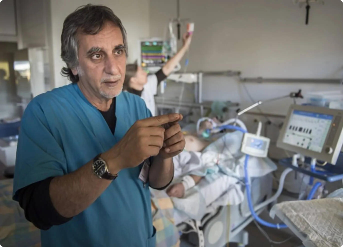 Dr. Waismann at a patient’s bedside in the hospital