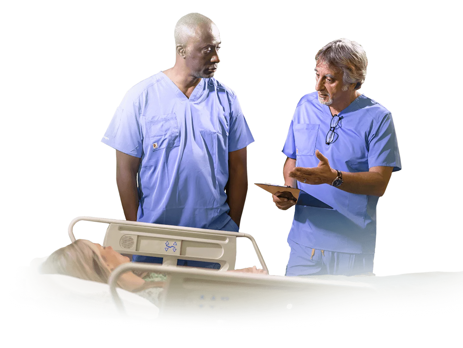 Dr. Waismann with a member of the medical team at a patient's bedside